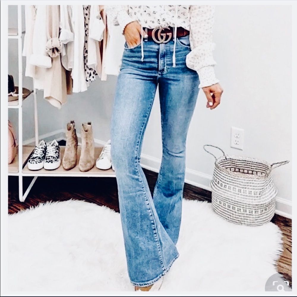 Mid Rise washed denim flared jeans. Size 27. Has some stretch.